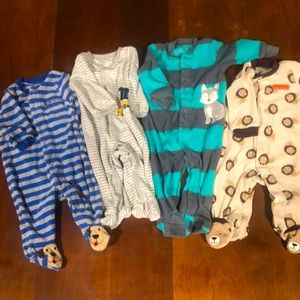 4 boys sleepers with feet. Carter’s Made with cotton and polyester.